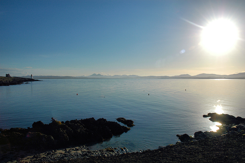 Picture of a view over a sea loch on a bright sunny morning
