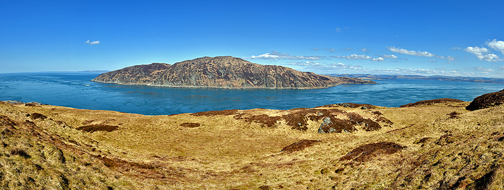 Panoramic picture of a gulf between two islands on a beautiful sunny spring day