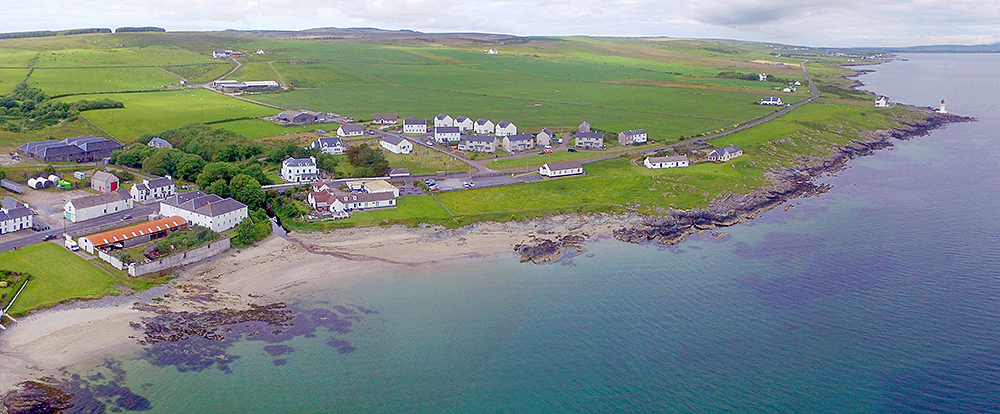 Panoramic picture of a part of a coastal village from the air