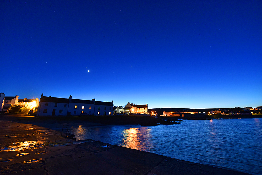 Picture of a coastal village in the gloaming after sunset