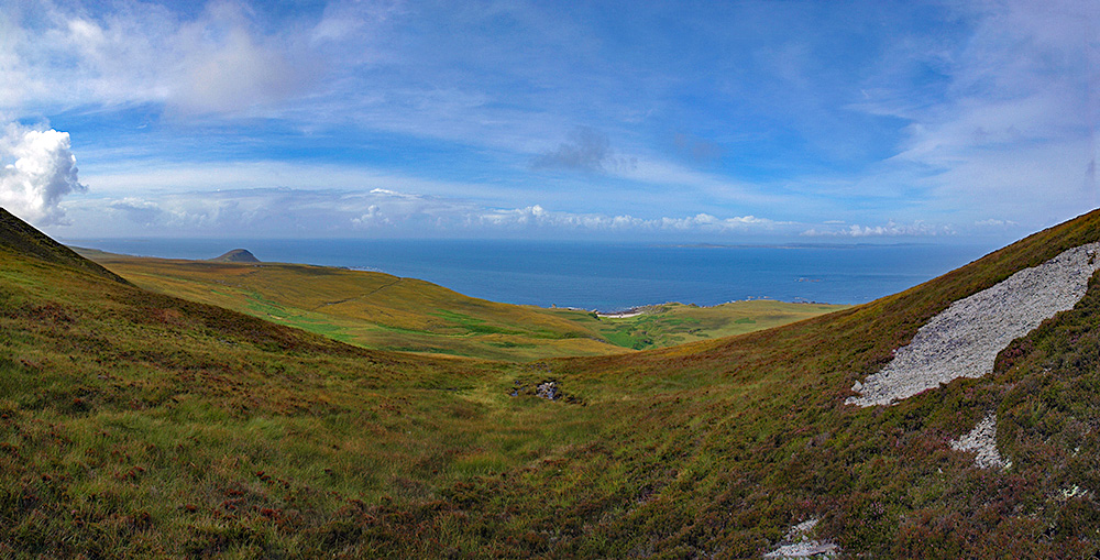 Panoramic picture of a shore seen from hills along the coast