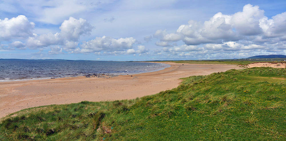Picture of a beach below some dunes stretching out into the distance
