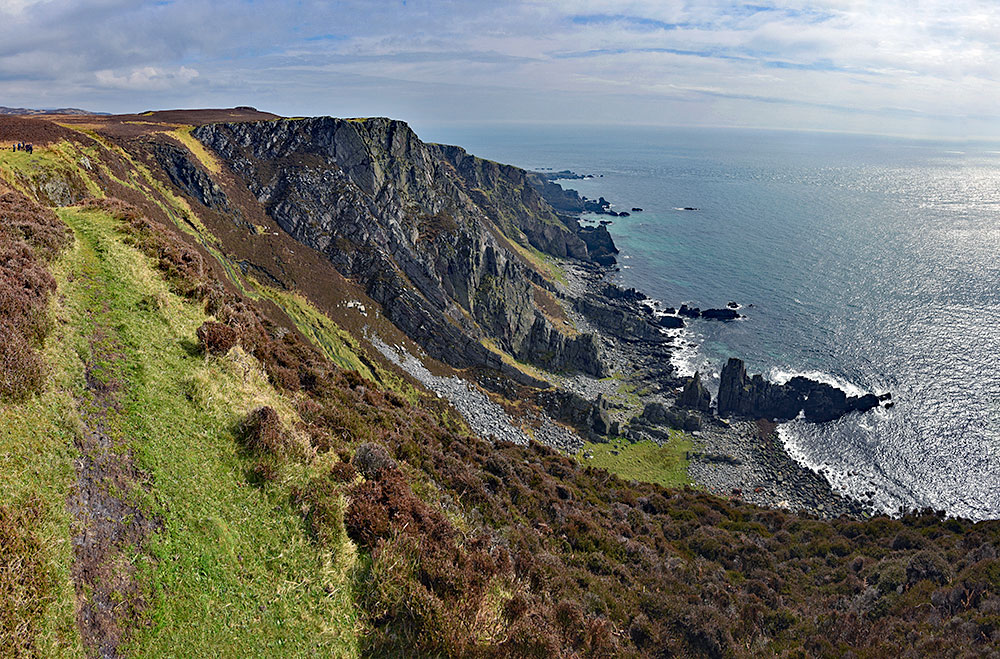 Picture of some steep and high cliffs above the sea