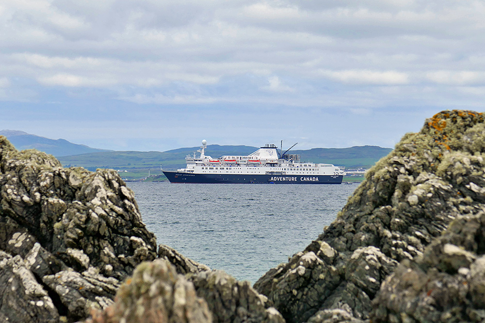 Picture of the MV Ocean Endeavour cruise liner seen through some rocks