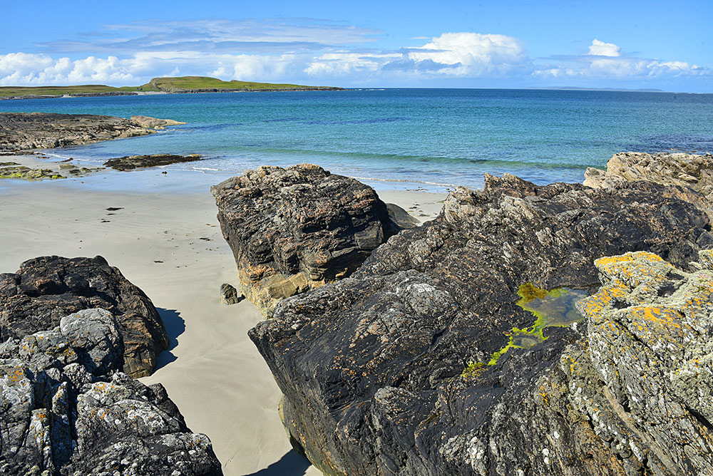 Picture of a varied coastal scenery with rocks, cliffs and beach