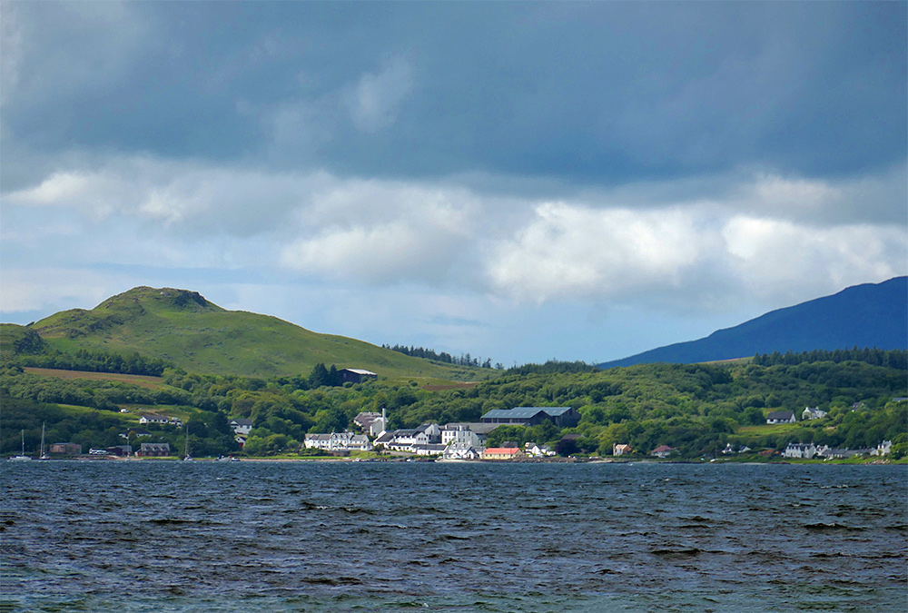 Picture of a small coastal village with a hotel and a distillery