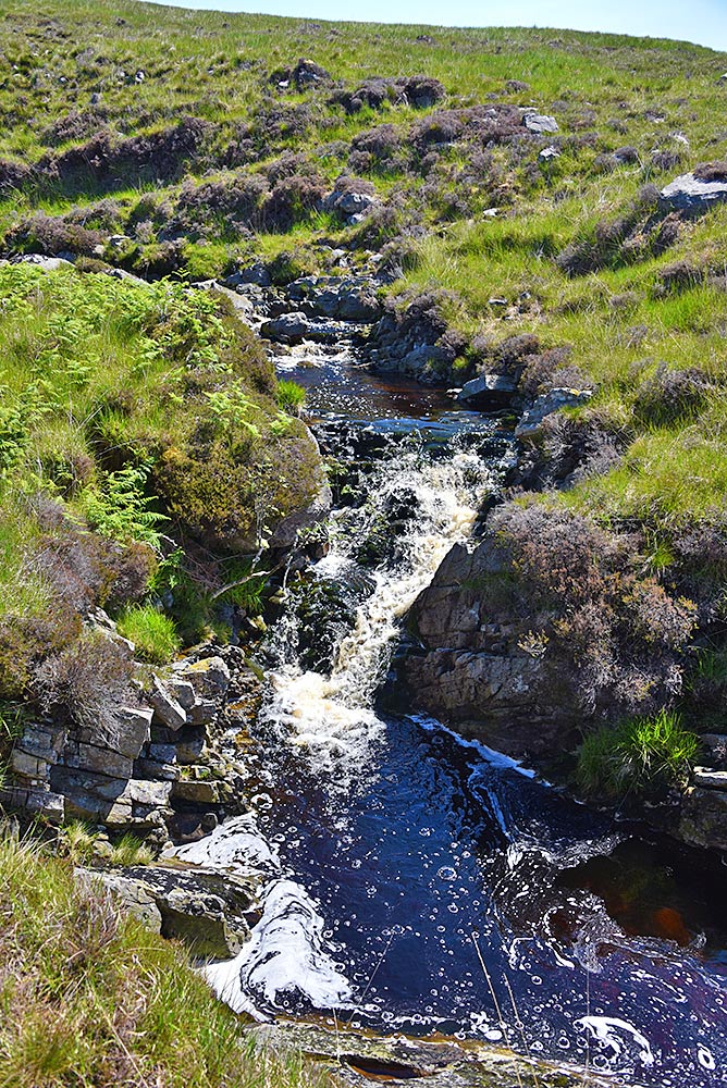 Picture of view down on to a small waterfall