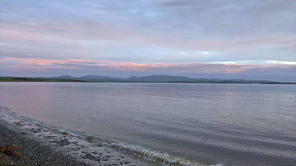 Picture of a calm sea loch on a cloudy evening