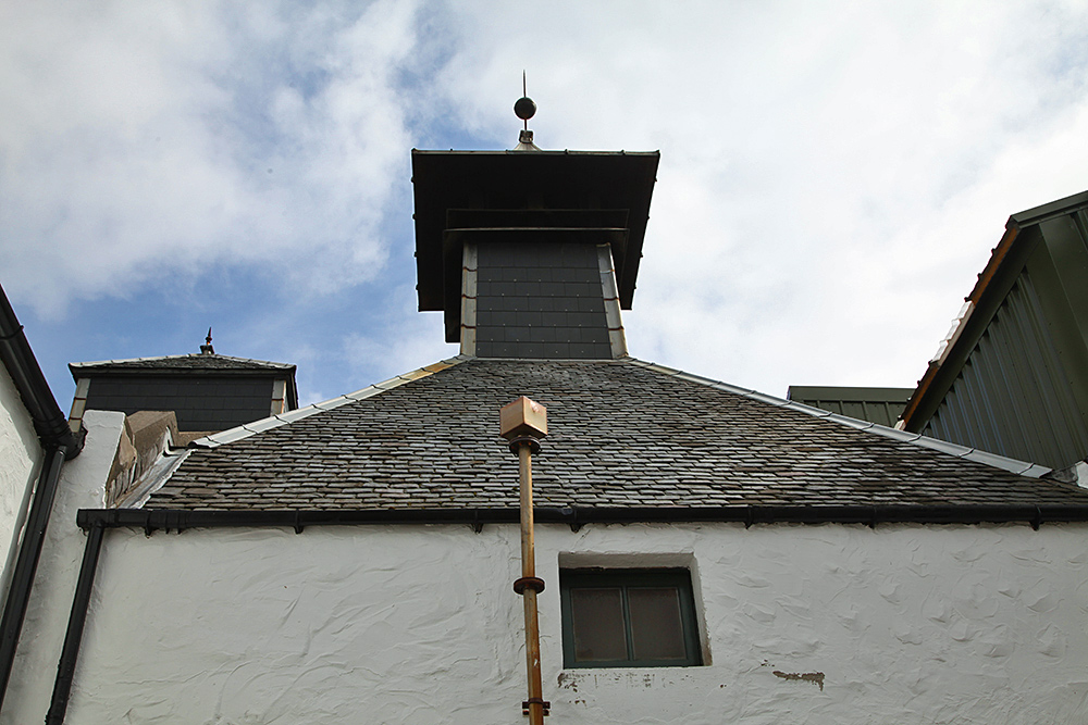 Picture of various roofs including a pagoda at Laphroaig distillery on Islay