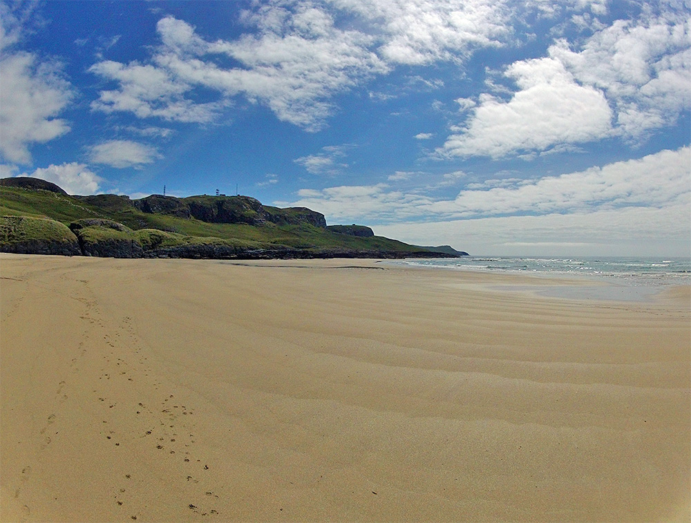 Picture of a wide sandy beach taken on a bright day with a GoPro camera