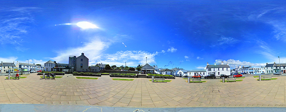Panoramic 360° picture from a village square on a sunny day