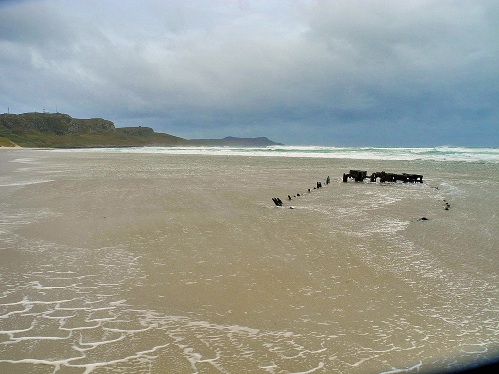 Picture of an wreck on a beach on an overcast blustery day