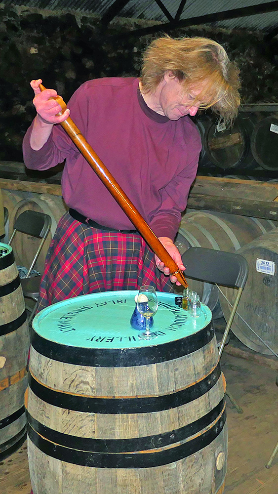 Picture of filling small sample bottles with a valinch from a cask
