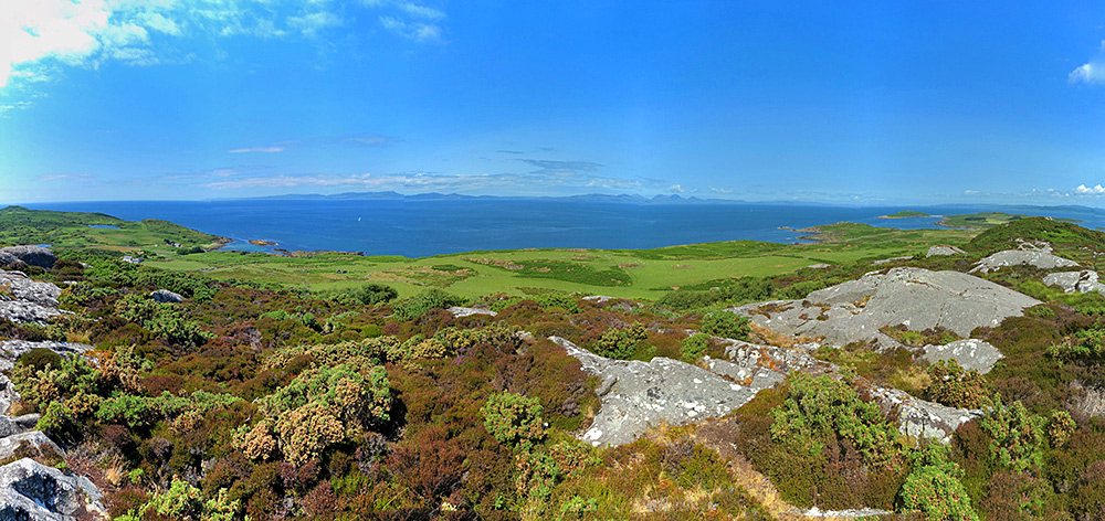 Panoramic picture of the view west from the highest hill on the Isle of Gigha, looking towards Islay and Gigha