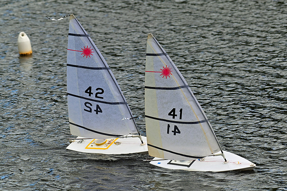 Picture of two Laser dinghy models sailing past a buoy