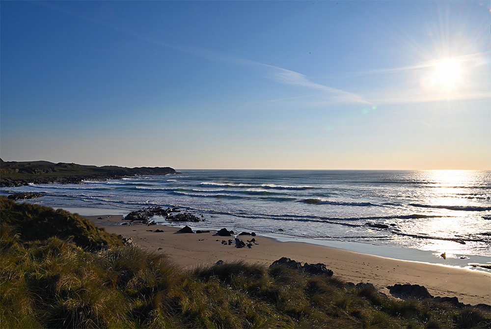 Picture of a beach in some beautiful April evening light seen from the dunes behind the beach