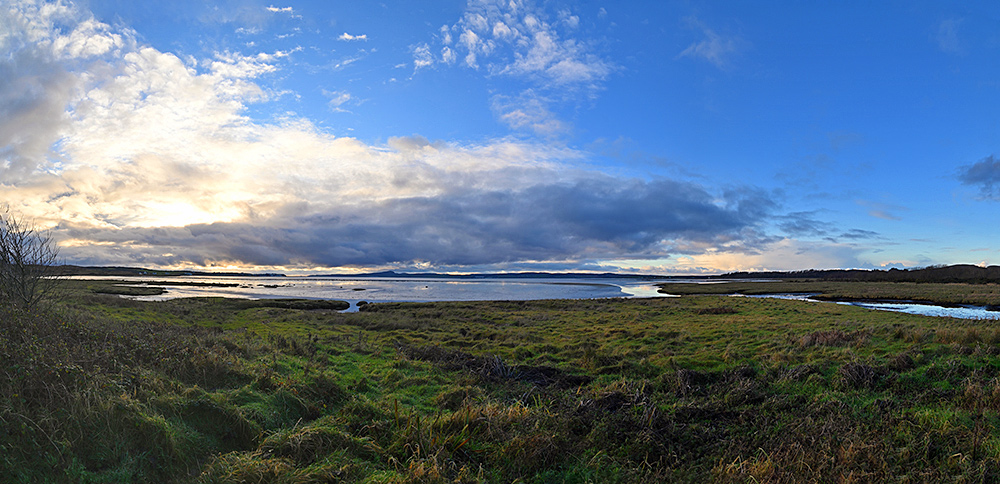 Panoramic picture of a view over the top of a sea loch on a November afternoon