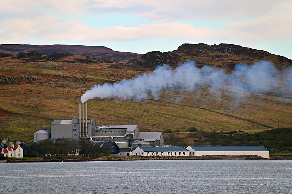 Picture of a modern malting with some old whisky distillery warehouse on a coast