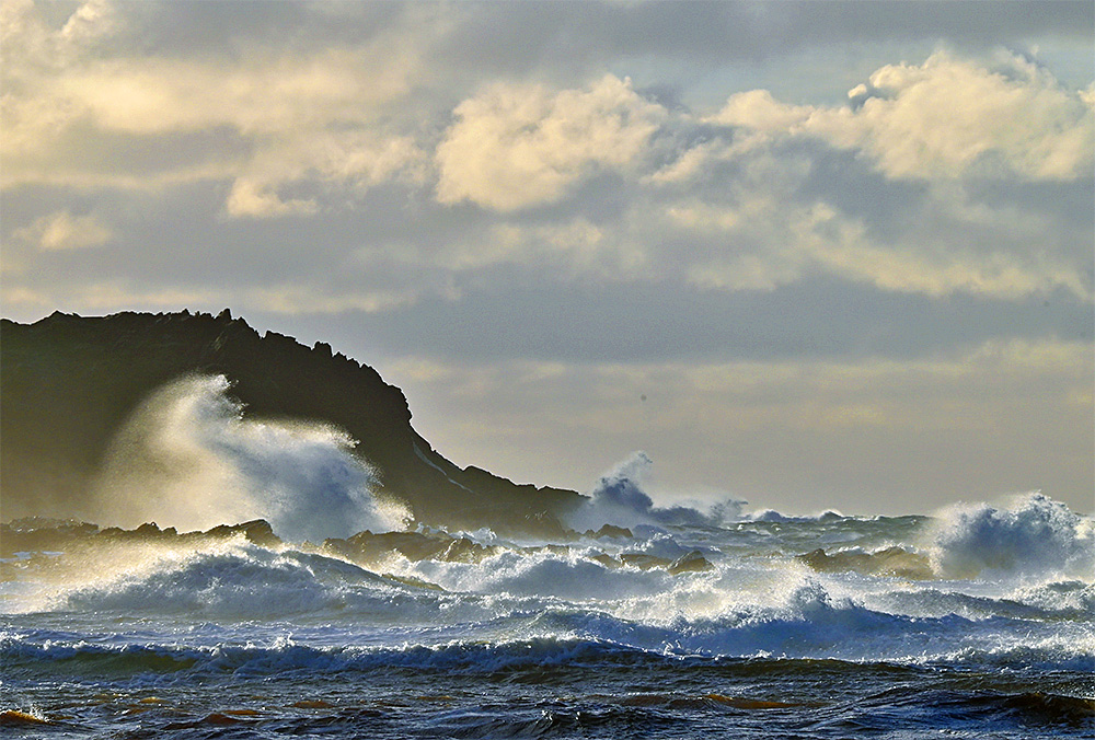 Picture of a big wave splash after a wave hit a coastal rock