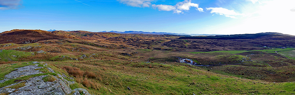 Picture of a hilly rural landscape seen from the top of a hill