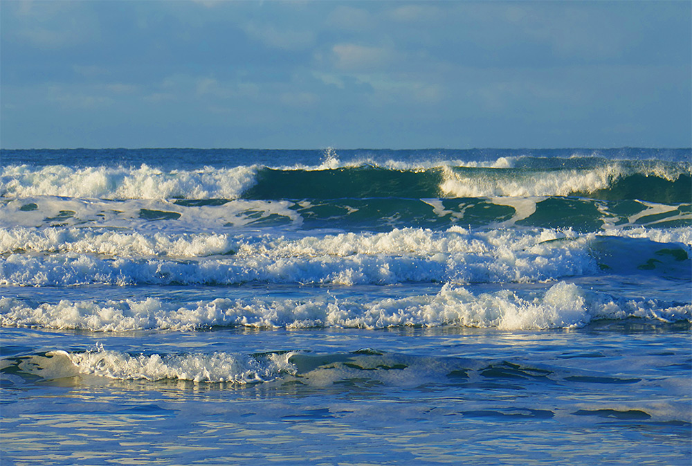 Picture of some waves breaking as they approach a beach
