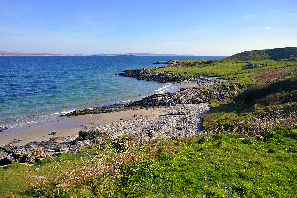 Picture of two small beaches on the shore of a sea loch in nice April sunshine