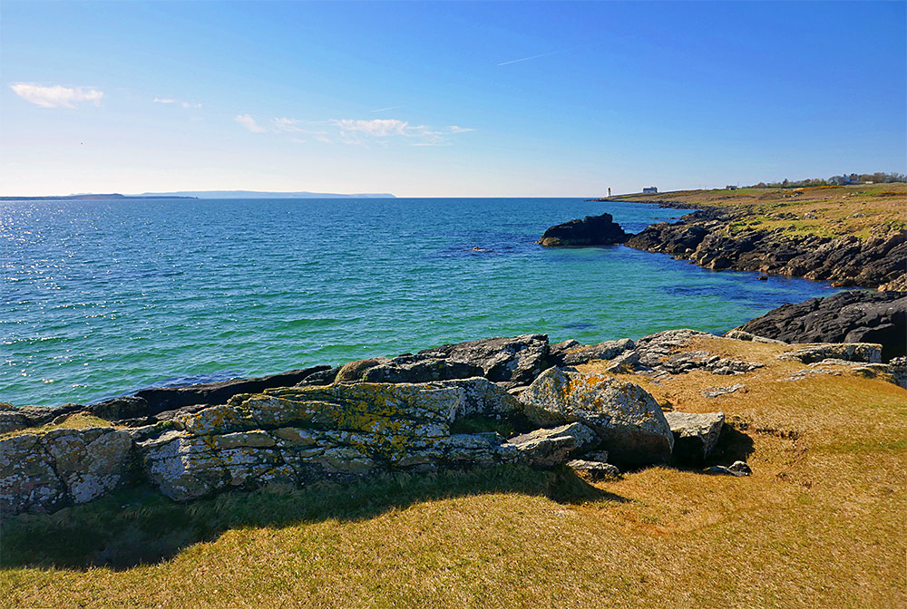 Picture of a view over a wide sea loch from a rocky shore in beautiful April sunshine