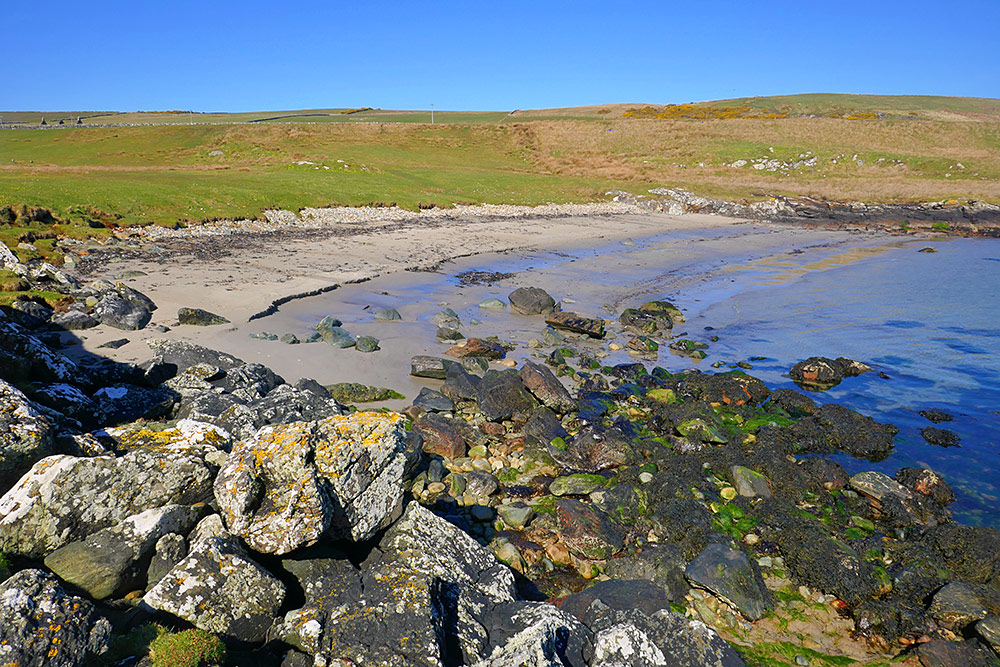 Picture of a small sandy beach in beautiful April sunshine